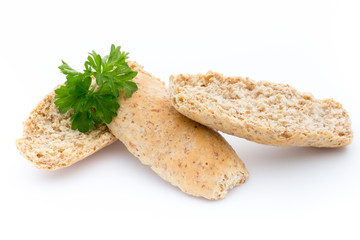Dry flat bread crisps with herbs on a white background.