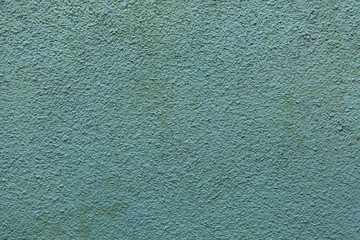 Green painted stucco wall. Background texture