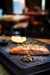 Salmon steak served on a warm plate