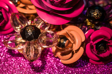Jewelry background with luxury flowers on pink glitter