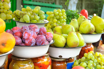 Farm market photo with different vegetables, fruits and homemade preserves - shallow depth of field.