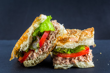 Flatbread tuna sandwich on slate plate