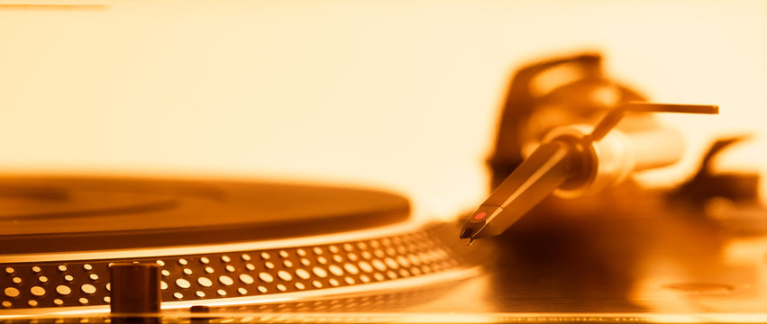 turntable headshell and platter dots, macro view, golden tone
