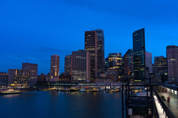 Fototapeta na wymiar Aerial view of Sydney Central Business District skyscrapers on dusk. Urban landscape view from above. Circular Quay, Australia