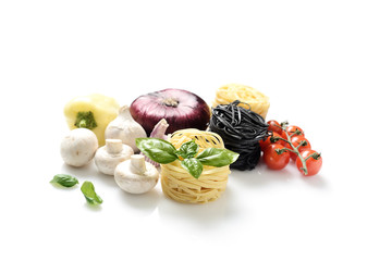 white and black pasta and fresh basil, mushrooms, cherry tomatoes, onions, peppers on a white background