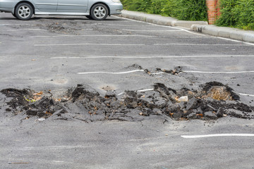 Asphalt surface was demolished due to poor construction.