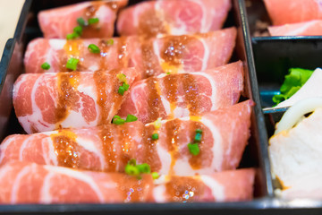 Raw kurobuta pork slices on plates, for sukoyaki and yakiniku ho