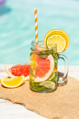 Detox citrus infused water as a refreshing summer drink.