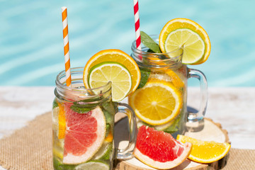 Detox citrus infused water as a refreshing summer drink.