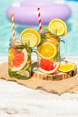 Detox citrus infused water as a refreshing summer drink.