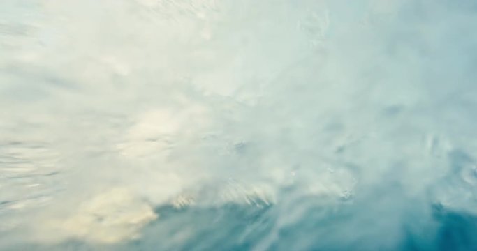 Beautiful young woman kiteboarding at sunset in slow motion, active lifestyle extreme sport