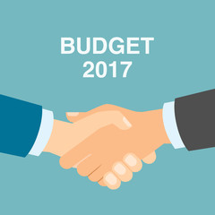 Budget 2017 handshake. Businessmen shaking hands in agreement about budget in 2017. Business strategy in 2017.