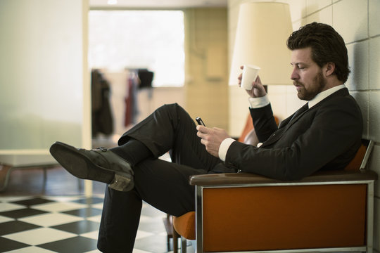 Caucasian businessman using cell phone