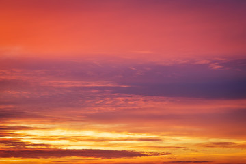 Naklejka na ściany i meble Beautiful fiery colorful sunset sky.