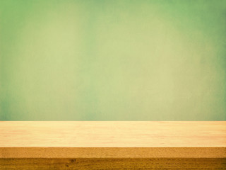 Wooden Table on Pastel Green Wall