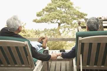 Senior couple holding hands outdoors