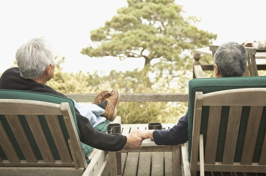 Senior couple holding hands outdoors