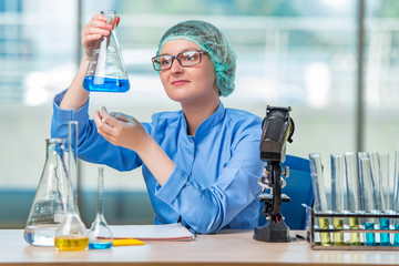 Experienced lab assistant working on chemical solutions