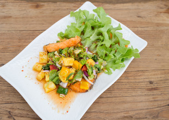Salmon fish sauce dressing, vegetables, fruit.
