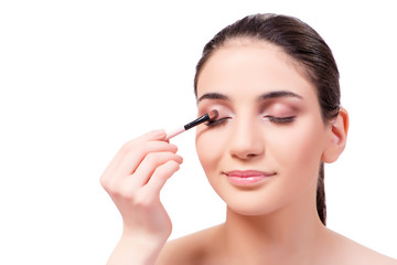 Beautiful woman during make-up cosmetics session