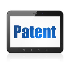 Law concept: Tablet Computer with Patent on display