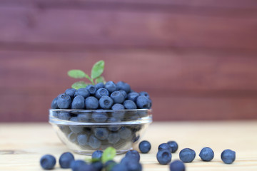 Blueberry on wooden background. Blueberry close up and blueberry background. Berries closeup. 