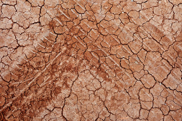 Tire tracks on the road gravel stone background