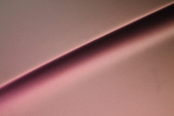 Macro of rose metallic lack surface of a car. Awesome background