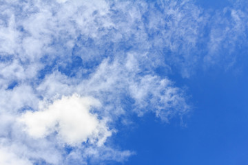 Blue sky background with white clouds. The vast blue sky and clouds sky on sunny day. White fluffy clouds in the blue sky.