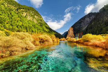 Amazing sunny landscape with azure river among mountains