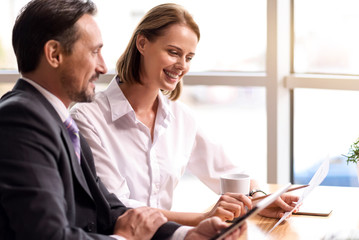 Cheerful colleagues working on the project