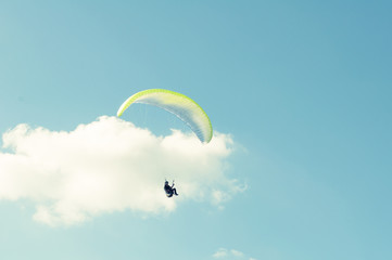 Paraglider turning around in the sky