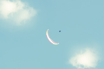 Obraz na płótnie Canvas Paraglider in the sky making a loop