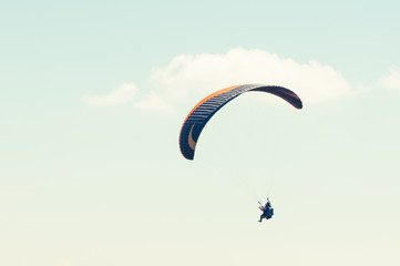 Paraglider enjoying the blue sky or sunny day