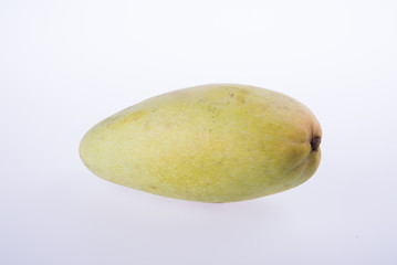mangos or green yellow mangos on background.