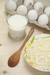 Milk products and eggs on the wooden table. Protein breakfast