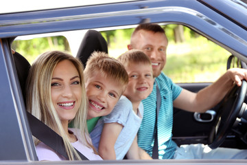 Fototapeta premium Beautiful family in car