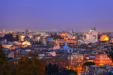 Fototapeta na wymiar Rome (Italy) - The famous Janiculum hill and terrace, with emotional cityscape on the Italy capital. Here: cityscape at the dusk