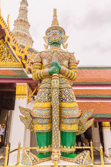 Obraz premium Giant statue at the emerald Buddha temple, Bangkok, Thailand