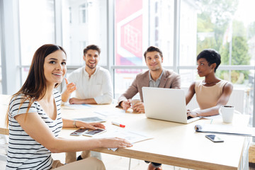 Business people using laptop and listening presentation in office