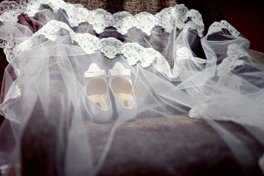 Beautiful colorful wedding shoes for bride indoors. Beauty of bridal heel for marriage. Female couple boots for celebration