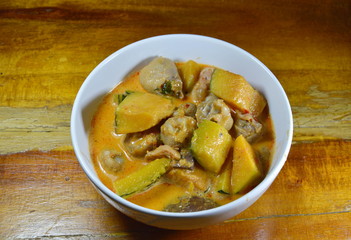 spicy pumpkin with ligament chicken in coconut cream curry on bowl