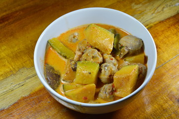 spicy pumpkin with chicken knees in coconut cream curry on bowl
