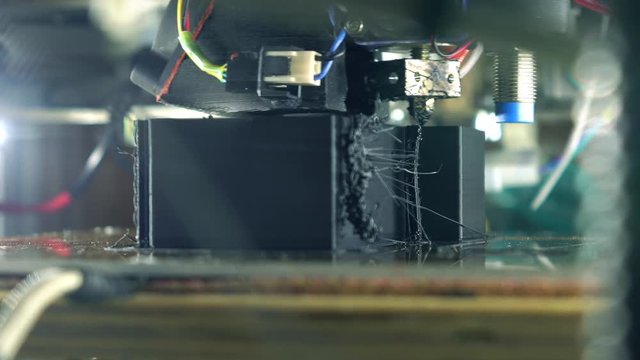 Affordable DIY 3d printer in action, close up 4K shot