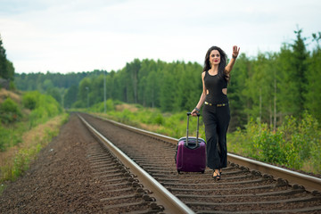 Fototapeta na wymiar Brunette woman running after train