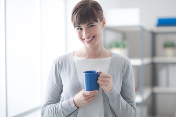 Woman having an hot coffee
