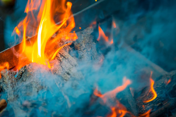 Fototapeta premium Beautiful burning fire flame background with smoke