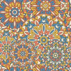 Seamless background with circular symmetrical mandalas.