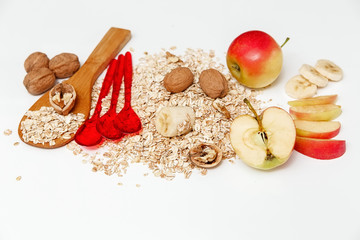 There are Pieces of Banana,Apple,Walnuts and Rolled Oats,Wooden and Plastic Spoons,Healthy Fresh...