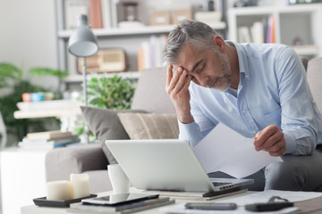 Businessman checking bills